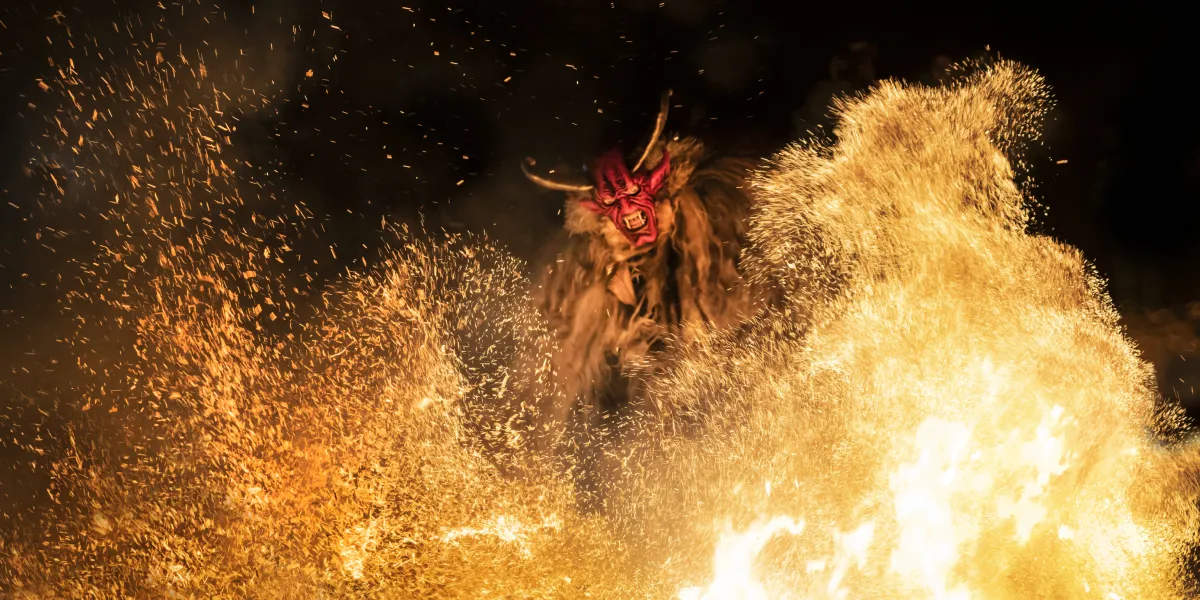 Krampus run through a town in Austria